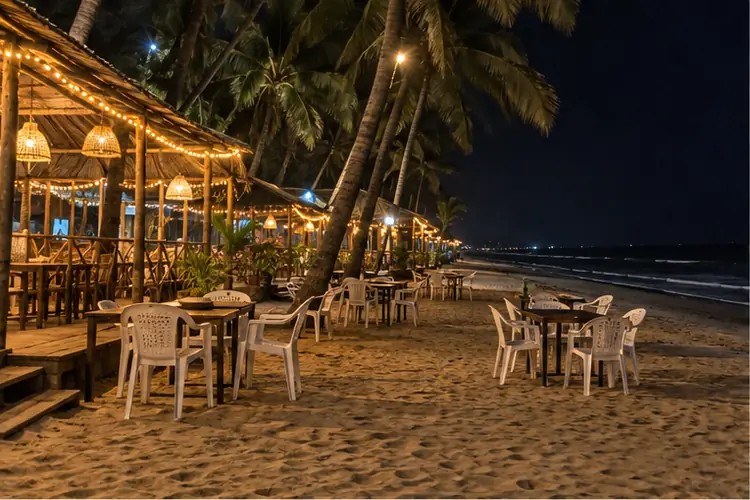 North Goa beach shacks at night with fairy lights and plastic chairs